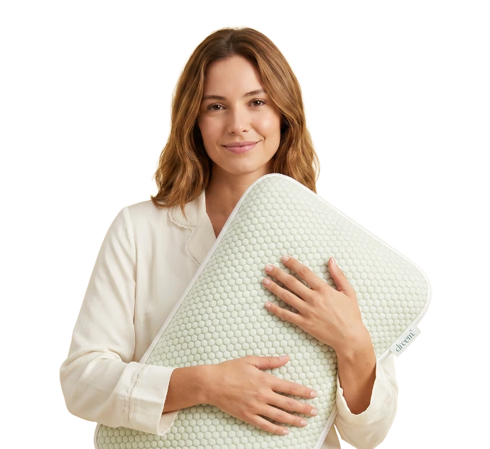 A woman holding the Dreem pillow